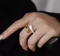 Minimalist gold plated water drop ring with white enamel finish worn on finger - US 6 / White