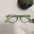 Vintage oval sunglasses in translucent green frame for a trendy minimalist style - Green 2