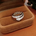 Macro shot of silver snake ring with pavé cubic zirconia on brown velvet background - Silver