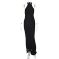 Close-up of black backless maxi dress with halter neck and white contrast trim hem - L / Black