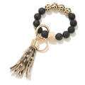 Close-up of black matte beads and leopard print wood bead keyring with gold clasp - Black Yellow Leopard