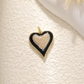 Golden heart pendant with black base and pavé cubic zirconia leopard pattern detail - A0223 Rhinestone Pave Heart - Black Gold