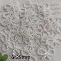 Detail view of 16x29mm white pearl butterfly DIY jewelry accessories with size marker - 16*29mm Large Bow