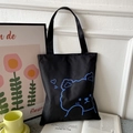 Versatile black canvas tote bag featuring a minimalist blue linear cartoon bear design - Black with Blue Heart Bear