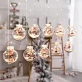 Christmas ball string lights featuring mini Santa Claus, fake snow, and red berries decor - Santa Claus Globe Hanging Lights