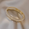 Elegant gold bracelet with micro-pave zircons and rectangular crystals on silk fabric - Bangle - Gold Crystal Rhinestone