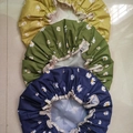Three-piece waterproof shower caps with daisy patterns in yellow, green, and blue colors - Olive Green Daisy