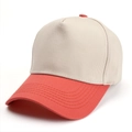Close-up of the fine twill cotton fabric and orange stitching on the baseball cap brim - Adjustable / Beige and Orange
