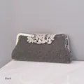 Elegant black evening clutch bag with sparkling crystals and silver leaf-shaped metal clasp - Black