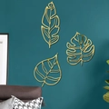 Lot de trois décorations murales feuilles dorées creuses pour un salon moderne - Or