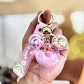 Pink cartoon mouse head liquid quicksand keychain with wish strap and golden bell - Pink