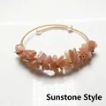 Detail van 14K goudomwikkelde armband met zonnesteen grind en zoetwaterparels - Zonnesteen