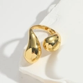 Minimalist gold waterdrop ring with abstract sculptural design on white textured stone - Smooth Tail Style (Gold)