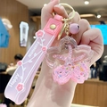 Pink cherry blossom liquid keychain with floating starfish and Happy Moments wristlet - Pink