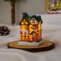 Close-up of glowing resin Christmas ice cream shop model with warm LED lights and snow - Ice Cream Shop (Style G)