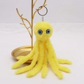 Cute yellow plush octopus keychain with blue eyes on golden display stand - 18cm / Yellow