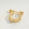 Macro detail of golden U-shaped stud with bead texture and sparkling zircon stones - Twisted Chain