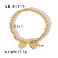 Detailed macro view of gold beaded chain bracelet with engraved sky and crown charms - Gold Metal Bead Heart Charm Bracelet (NB-B1119)