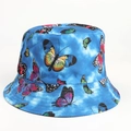 Close-up of blue tie-dye bucket hat featuring colorful butterfly prints and stitched brim - M (56-58cm) / Butterfly-Blue