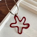 Cartoon red star pendant necklace with leopard print cord in a beige jewelry box - Painted Leopard Leather Flower Style