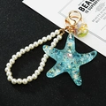 Blue starfish keychain with gold foil flakes, white pearl chain and metal lobster clasp - Single OPP Bag Packaging / Pearl + Jelly Shell Starfish Blue
