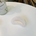 Minimalist semi-circular cream hair claw clip with smooth acrylic finish on white desk - Approx 7cm / Jelly White