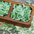 Detail shot of light green gradient glass bamboo-shaped beads in a dark wooden tray - Gradient Pale Green (J116#)