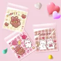 Detail of 10x10cm transparent self-adhesive bags with cute cartoon bear and bunny prints - 3-in-1 Bear Style / 10x10+3cm (Approx. 100pcs)