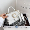 Elegant white crossbody bag with gold buckle and matching coin purse on a gift box - White