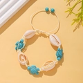 Detail of woven beach bracelet featuring natural shells and turquoise turtle beads - Turquoise Turtle Woven Style