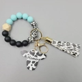 Silicone bead mama keychain with cow print charm and black and white tassel bracelet - Cyan