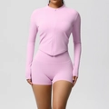 Detail of lavender yoga set featuring a zip-up jacket with thumbholes and V-shaped hemline - Sakura Pink