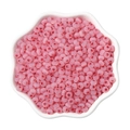Bulk 4mm pink cat eye glass seed beads in a white petal tray for DIY jewelry making - Red