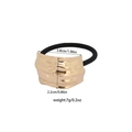Golden irregular alloy hair tie with wavy metal texture and black elastic ponytail holder - Wave Texture