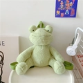 Cute green plush frog backpack with 3D eyes and adjustable straps in home setting - Light Green