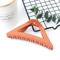 Matte orange triangle hair claw clip in minimalist hollow design for elegant styling - Matte Orange Yellow