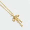 Collier avec pendentif nœud doré minimaliste et finition polie sur une chaîne fine - Nœud Doré / Doré