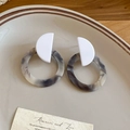 Detail showing marble resin drop earrings with geometric shapes on a ceramic plate - White Marble Pattern (925 Sterling Silver Earring Post)