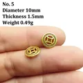 Detailed close-up of a 10mm golden coin spacer with traditional embossed patterns - Style 5/Gold/Diameter 10mm