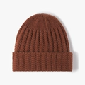 Brown knitted beanie hat with thick ribbing and wide folded cuff for winter warmth - Rust red
