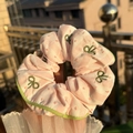 Pink and white striped scrunchie with green bow embroidery and hand-held details - Green Trim Pink Stripe Scrunchie with Green Bow