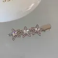 Macro shot of silver metal star hair clips with sparkling pink rhinestones and duckbill clasp - Three Stars / Silver