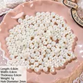 Macro shot of 8mm cream white rose-shaped ABS baroque pearl beads for DIY jewelry - Rose Stamen