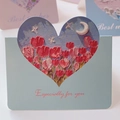 Light blue folded card with heart cutout showing tulip oil painting and Best Wishes text - Tulips Under the Moon
