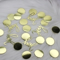 Golden Joy lettering and round sequins on white fur background for Christmas party decor - Gold Card Dots + Joy Confetti