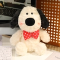 Adorable cream plush puppy toy with black ears and red polka dot bow tie on desk - 30cm Bowtie Style Dog