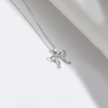 Collier minimaliste en argent avec pendentif nœud et chaîne en métal délicate - Nœud Argenté