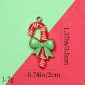 Detailed size view of red and white striped candy cane resin pendant with green bow - 16# Candy Cane