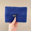 Detail showing dark blue ribbed knit fabric texture and stitched brand logo label - One Size / Klein Blue