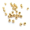 Golden frosted spacer beads with hammered texture for DIY jewelry making on white background - 3mm / 14K Gold